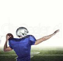 Composite image of rear view of american football player throwin