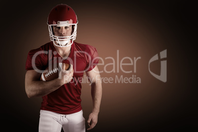 Composite image of american football player with ball