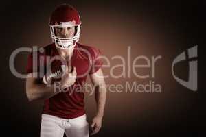 Composite image of american football player with ball