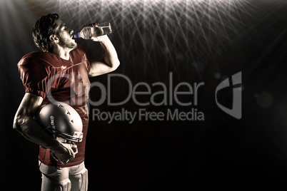 Composite image of thirsty american football player in red jerse