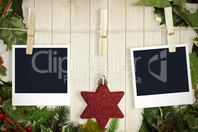 Composite image of hanging christmas photos