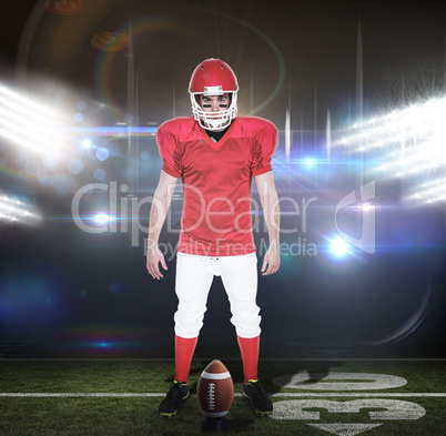 Composite image of serious american football player looking at c