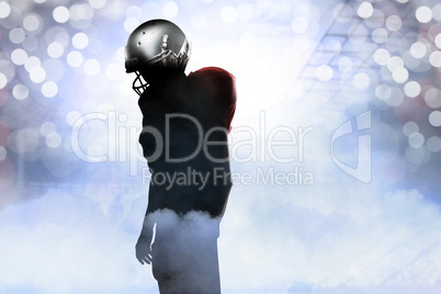 Composite image of american football player in red jersey lookin