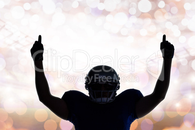 Composite image of silhouette american football player with thum