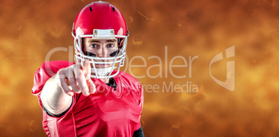 Composite image of portrait of american football player pointing