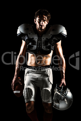Composite image of shirtless american football player with paddi