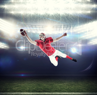 Composite image of american football player scoring a touchdown