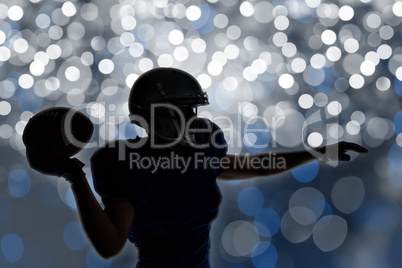 Composite image of silhouette american football player throwing