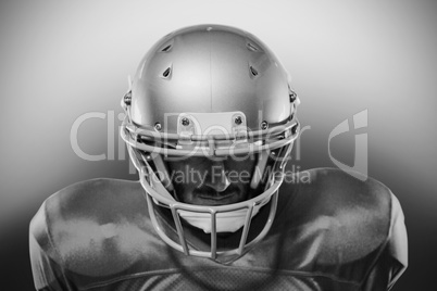 Close-up of serious American football player in red jersey looki