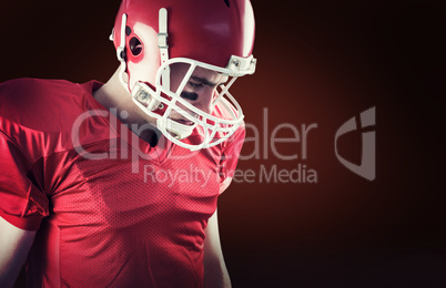 Composite image of american football player taking his helmet on