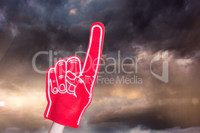 Composite image of american football player holding supporter fo