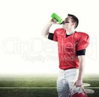 Composite image of american football player drinking