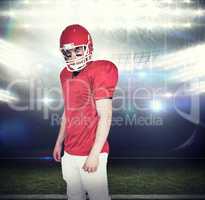 Composite image of serious american football player looking at c