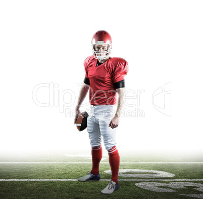 Composite image of portrait of american football player holding