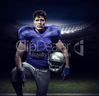 Composite image of portrait of serious sportsman with hand on kn