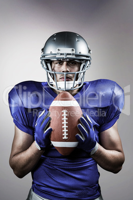 Composite image of portrait of confident american football playe