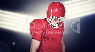 Composite image of unsmiling american football player looking do