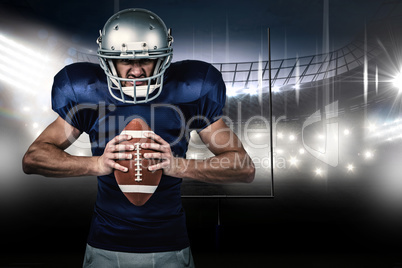 Composite image of angry american football player holding ball