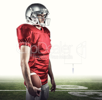 Composite image of serious american football player in red jerse