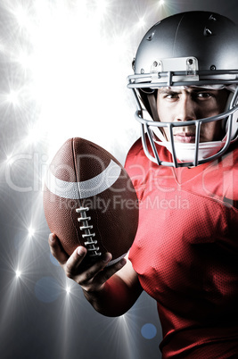 Composite image of portrait of determined american football play