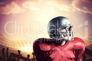 Composite image of american football player looking away while s