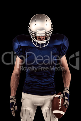 Composite image of confident american football player looking do