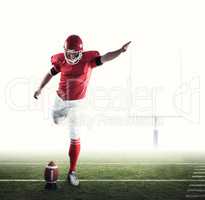 Composite image of american football player kicking football