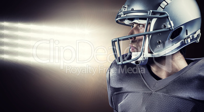 Composite image of sportsman with helmet looking away