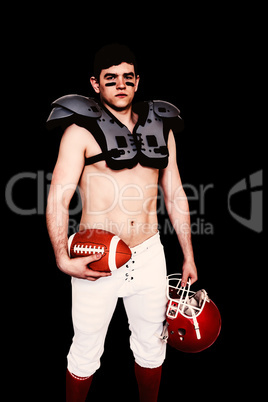 Composite image of american football player holding a ball and h
