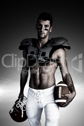 Composite image of portrait of rugby player holding ball and hel