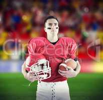 Composite image of american football player holding a ball