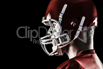 Composite image of american football player looking at camera