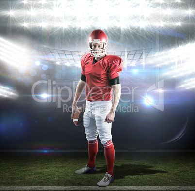 Composite image of portrait of american football player holding