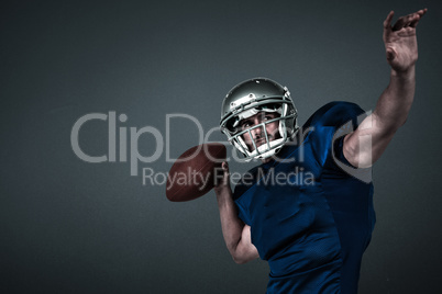 Composite image of american football player looking away while throwing the ball