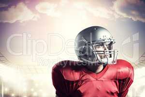 Composite image of american football player looking away while s