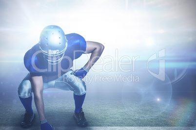 Composite image of american football player in uniform bending