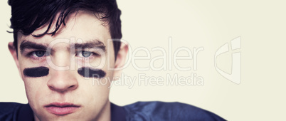 Composite image of american football player looking at the camer