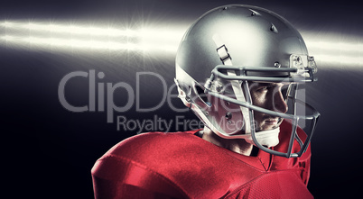 Composite image of confident american football player in red jer