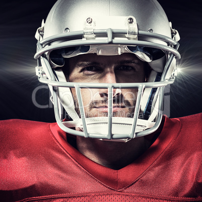 Composite image of confident american football player in red jer