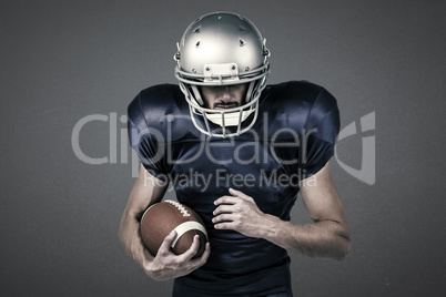 Composite image of sports player wearing helmet while holding ball