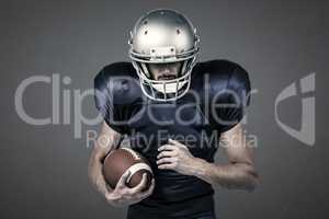 Composite image of sports player wearing helmet while holding ball