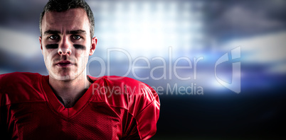 Composite image of portrait of a serious american football playe