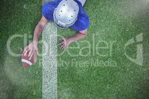 Composite image of rear view of american football player lying i