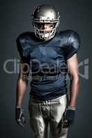 Composite image of american football player standing