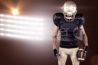 Composite image of american football player looking down