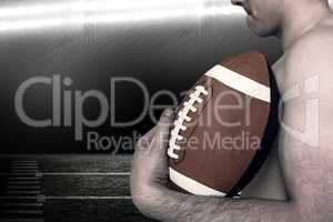 Composite image of shirtless american football player holding a