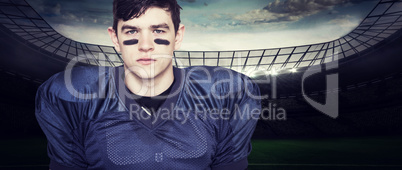 Composite image of american football player looking at the camer