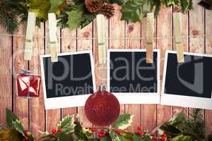 Composite image of hanging christmas photos