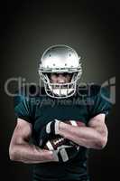 Composite image of portrait of confident sportsman holding ball