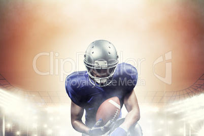 Composite image of american football player holding ball while k